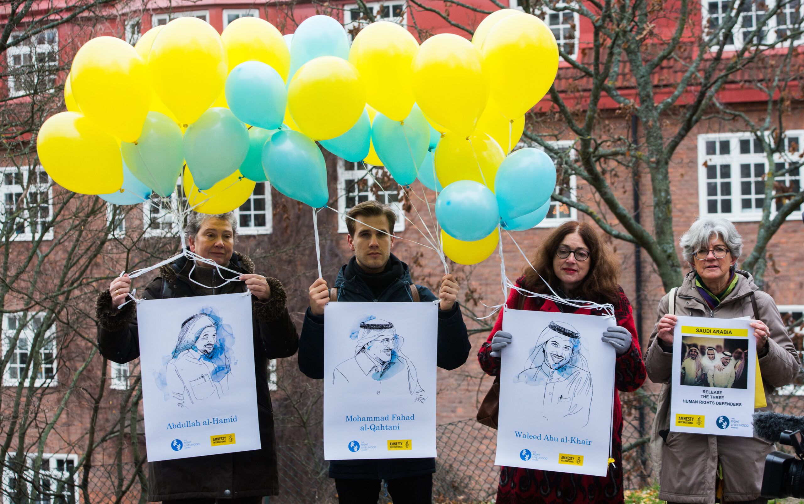 Drawings of Abdullah al-Hamid, Mohammad al-Qahtani and Waleed Abu al-Khair held outside the Saudi embassy in Stockholm during the 2018 Right Livelihood Award ceremony