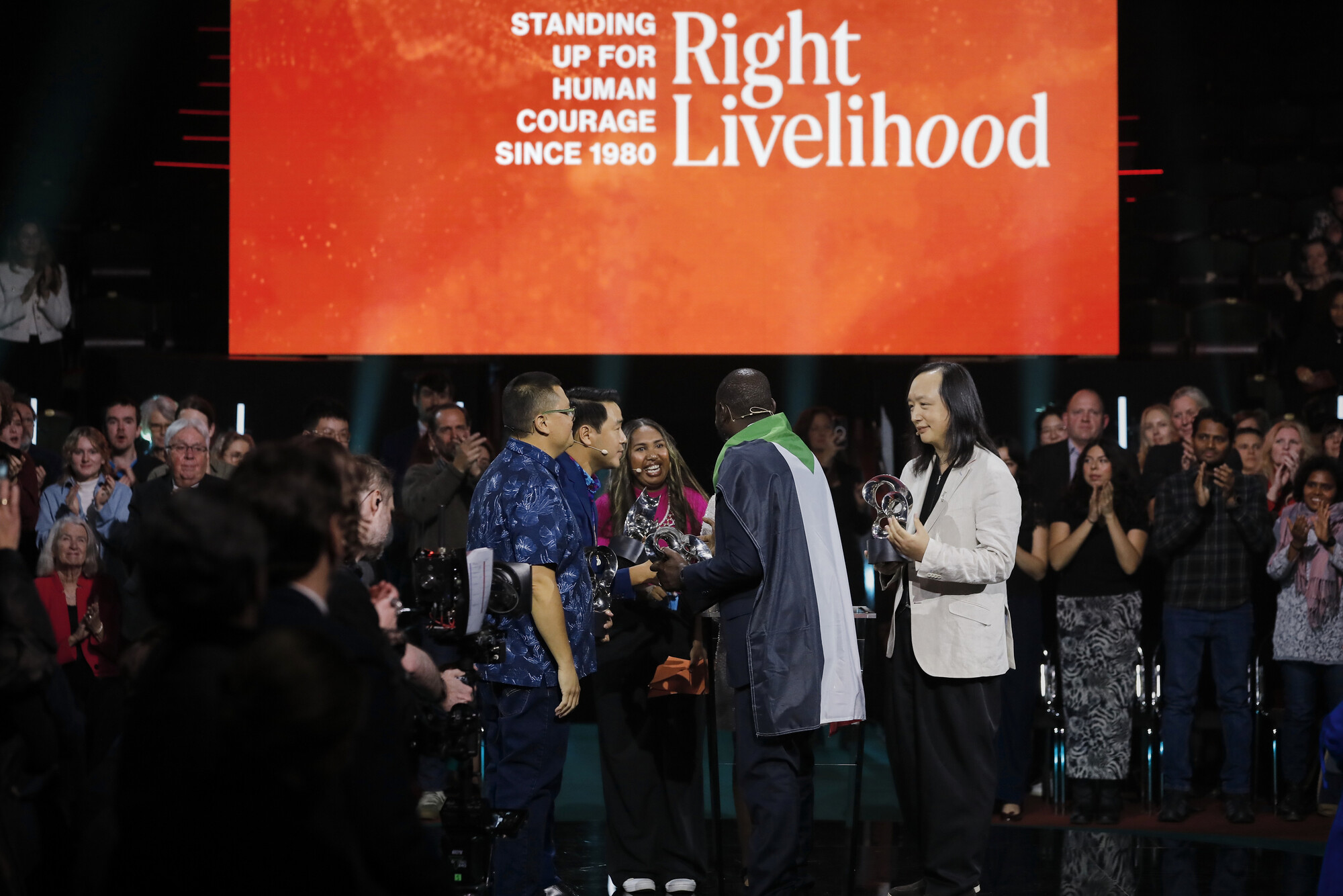 2025 Right Livelihood Laureates Julian Aguon, PISFCC (represented by Solomon Yeo and Belyndar Rikimani) Audrey Tang and Emergency Response Rooms (represented by Alsanosi Adam) with their award sculptures at Cirkus, Stockholm.