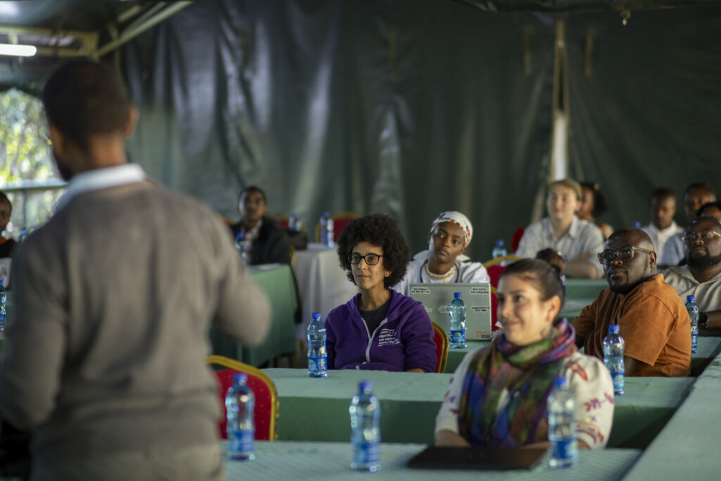 2026 Right Livelihood Laureate Timnit Gebru listening to public speaker at seminar